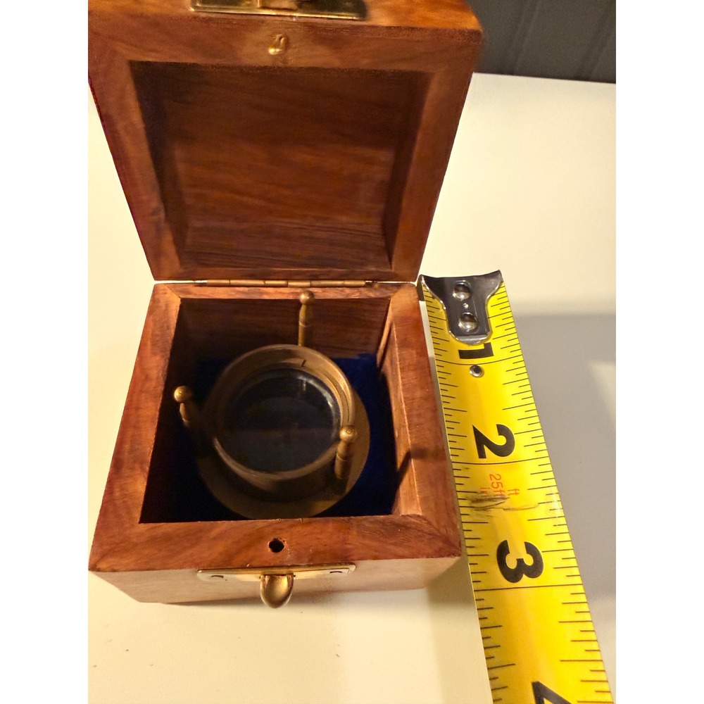 Brass magnifier in a wooden box